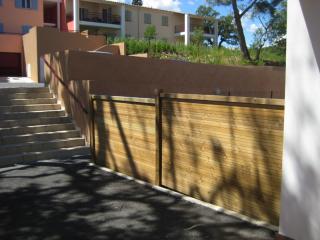 Wood panel fence installation